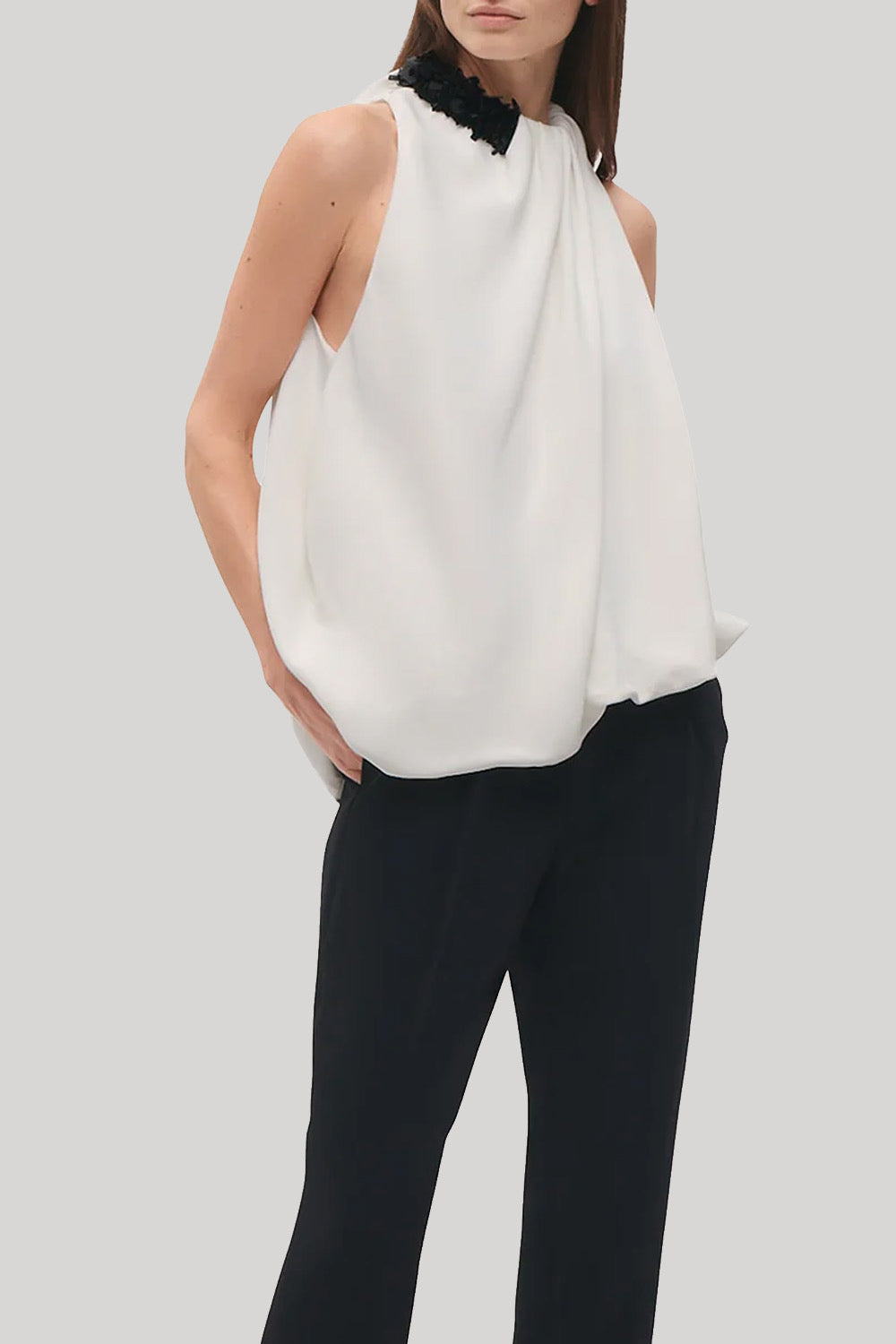 white draped top with beaded neck 