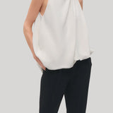 white draped top with beaded neck 