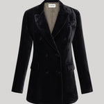 A black velvet double-breasted blazer with notched lapels and a structured silhouette from Parosh, shown on a neutral light gray background.