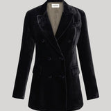 A black velvet double-breasted blazer with notched lapels and a structured silhouette from Parosh, shown on a neutral light gray background.