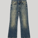 A pair of mid-waisted, cropped-leg blue denim jeans from R13 with a faded wash, shown flat against a solid light gray background. 