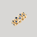 Audrey Cohen | Floating ring with blue sapphires
