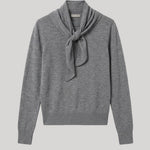 A heather gray knit sweater with a scarf detail