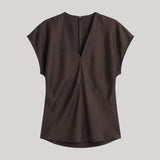 A dark brown short-sleeve top 