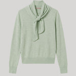 A light sage green knit sweater