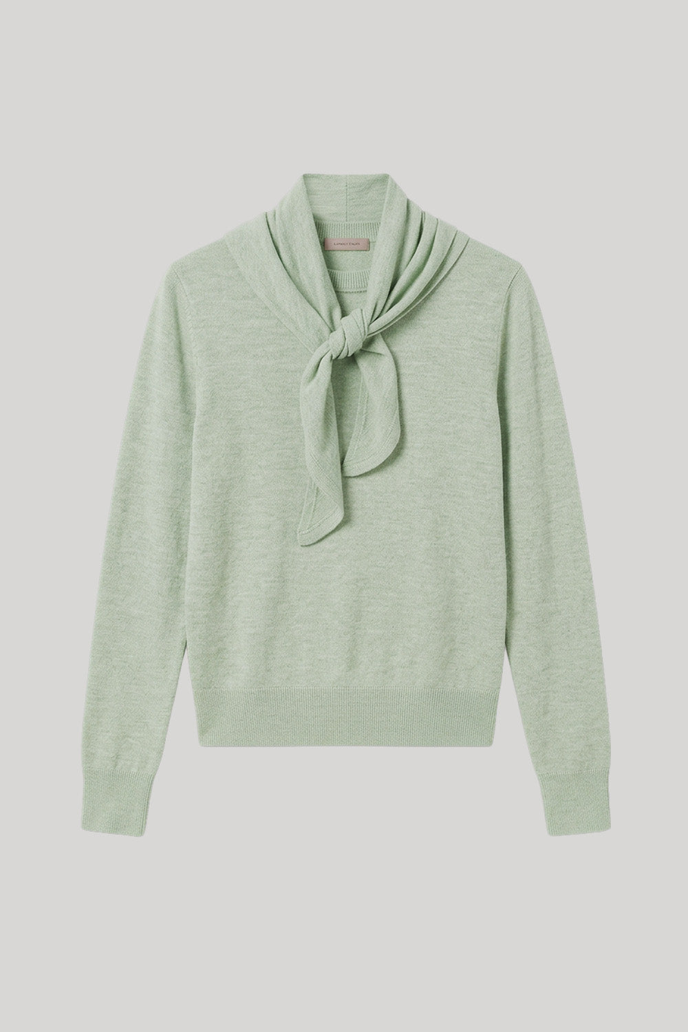 A light sage green knit sweater