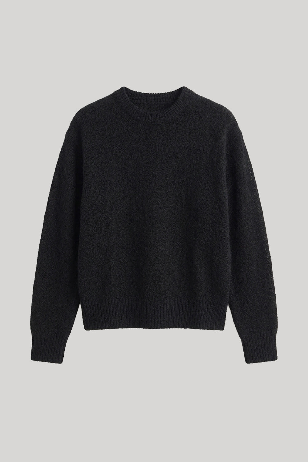 A black long-sleeve crewneck knit sweater