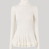 White turtleneck with ruffle detail