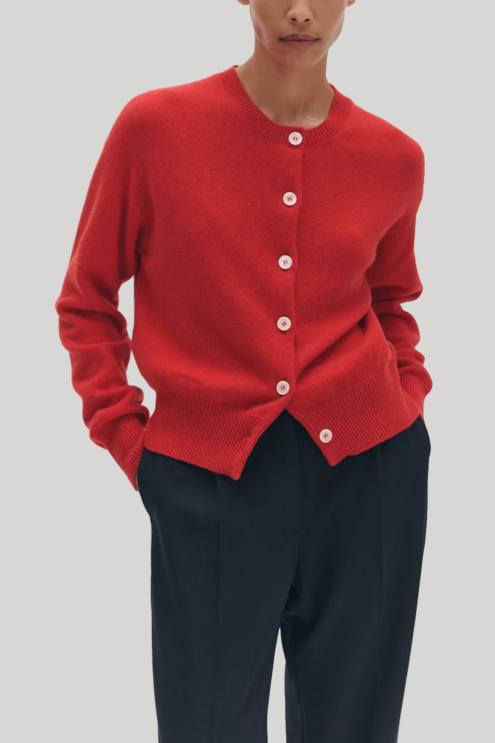 Red cardigan with white buttons