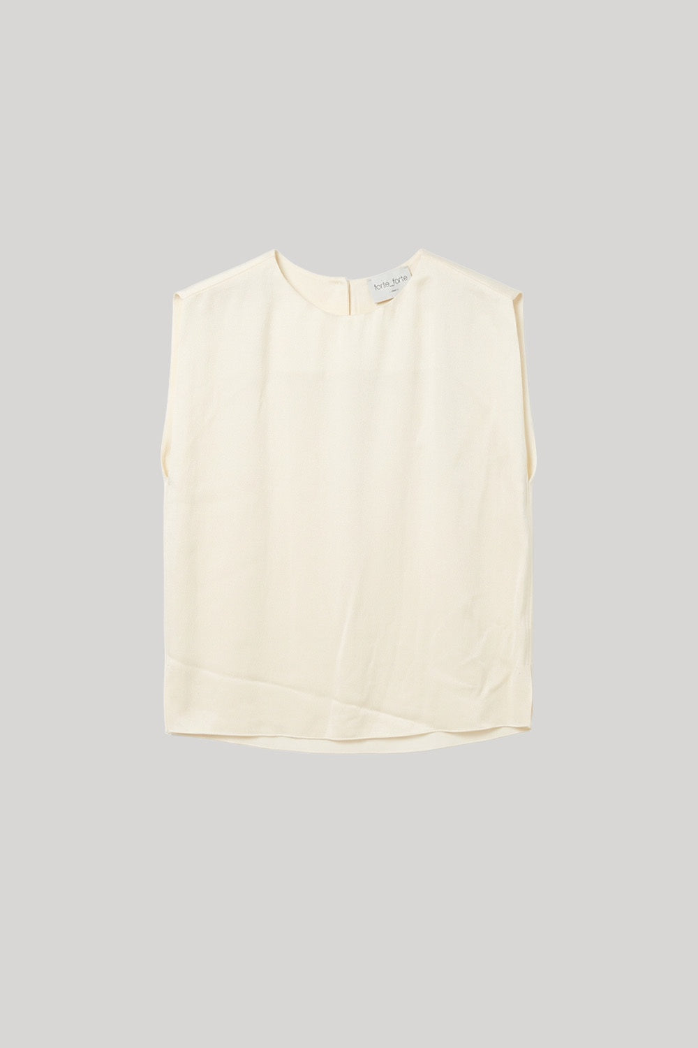 Sleeveless white blouse