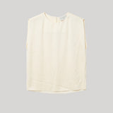 Sleeveless white blouse