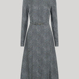 A long-sleeve collared dress in a textured gray and black herringbone pattern, from Gabriela Hearst, featuring a matching belt at the waist, shown against a solid light gray background.