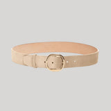 A light beige leather belt with a gold-tone buckle, from Gabriela Hearst, displayed in a curved shape on a solid light gray background.