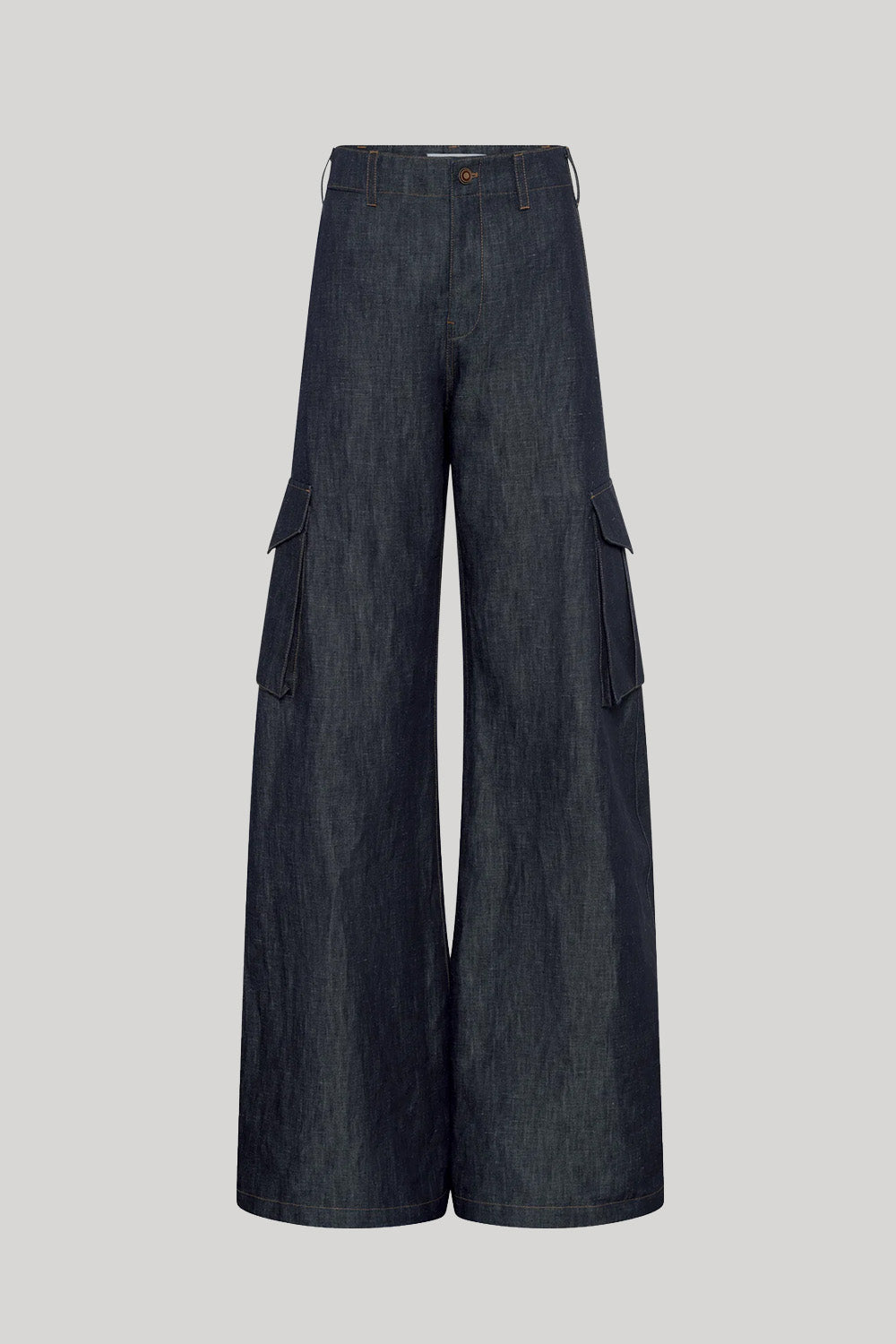 Dark blue wide-leg cargo pants made of denim-like fabric, featuring large flap side pockets, from Gabriela Hearst, shown against a solid light gray background.