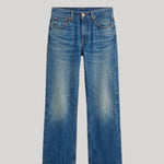 A pair of medium-wash blue denim jeans