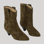 A pair of women's mid-calf ankle boots in dark olive suede, featuring a low block heel, pointed toe, and a pull tab at the back of the shaft, shown against a solid light gray background.