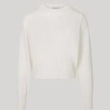 A white long-sleeve knit sweater