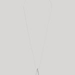 A minimalist silver teardrop pendant necklace on a fine silver chain, displayed against a solid light gray background.