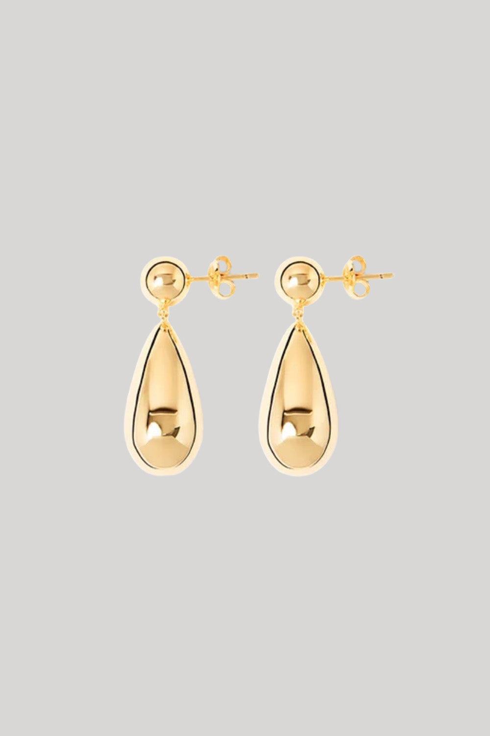 A pair of gold teardrop drop earrings with a polished reflective finish and post-back closures, shown against a solid light gray background.