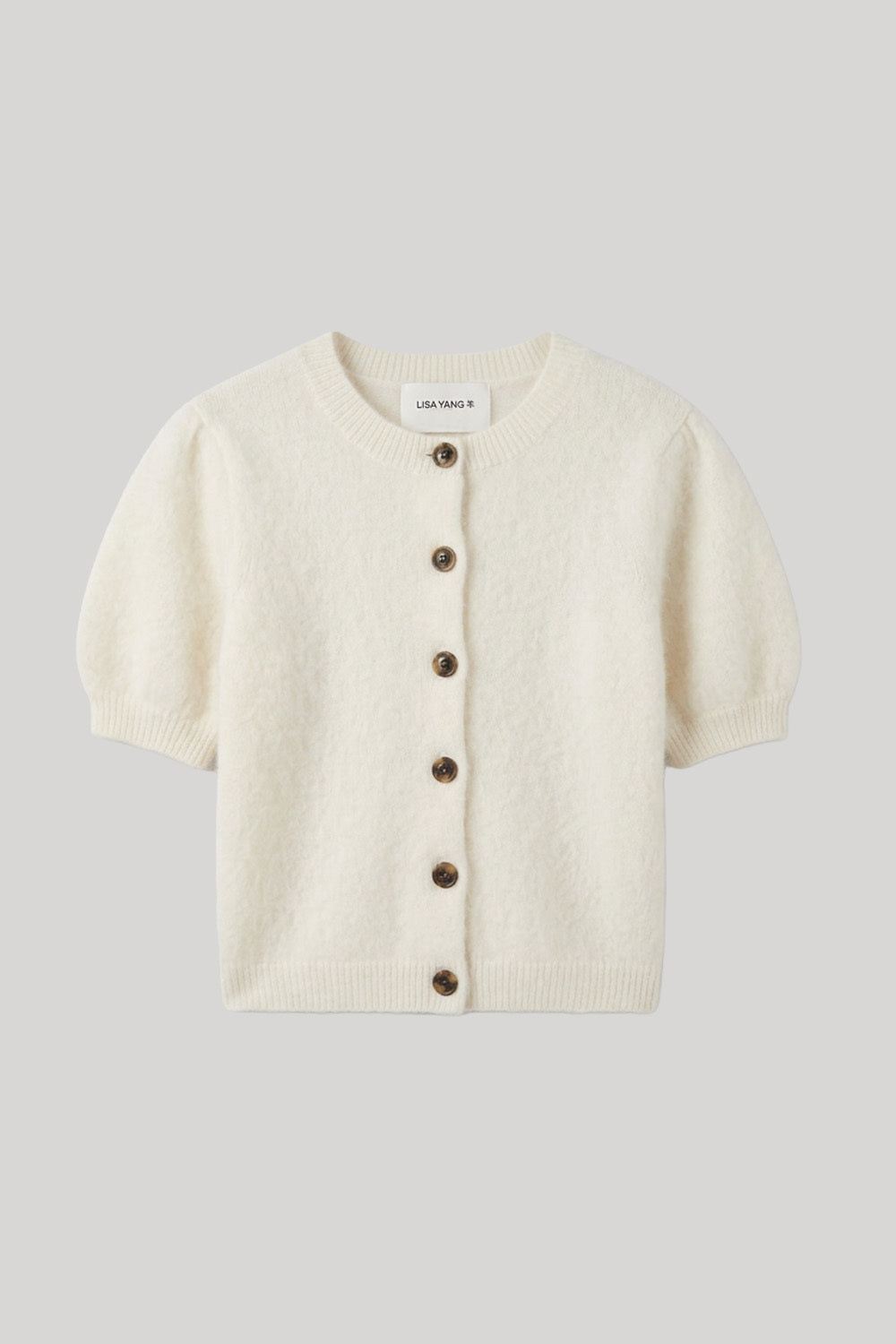 Cream button down short sleeve sweater with brown buttons