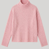 A light pink knit turtleneck sweater