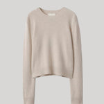 A light beige cropped knit sweater 
