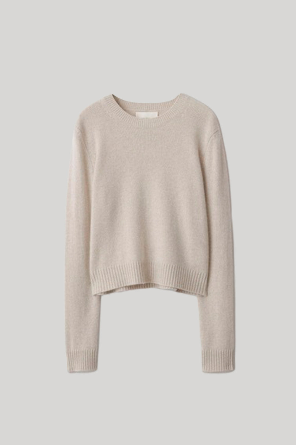 A light beige cropped knit sweater 