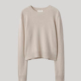 A light beige cropped knit sweater 