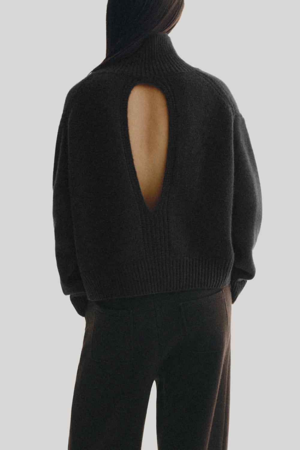 Black turtleneck sweater with back cutout