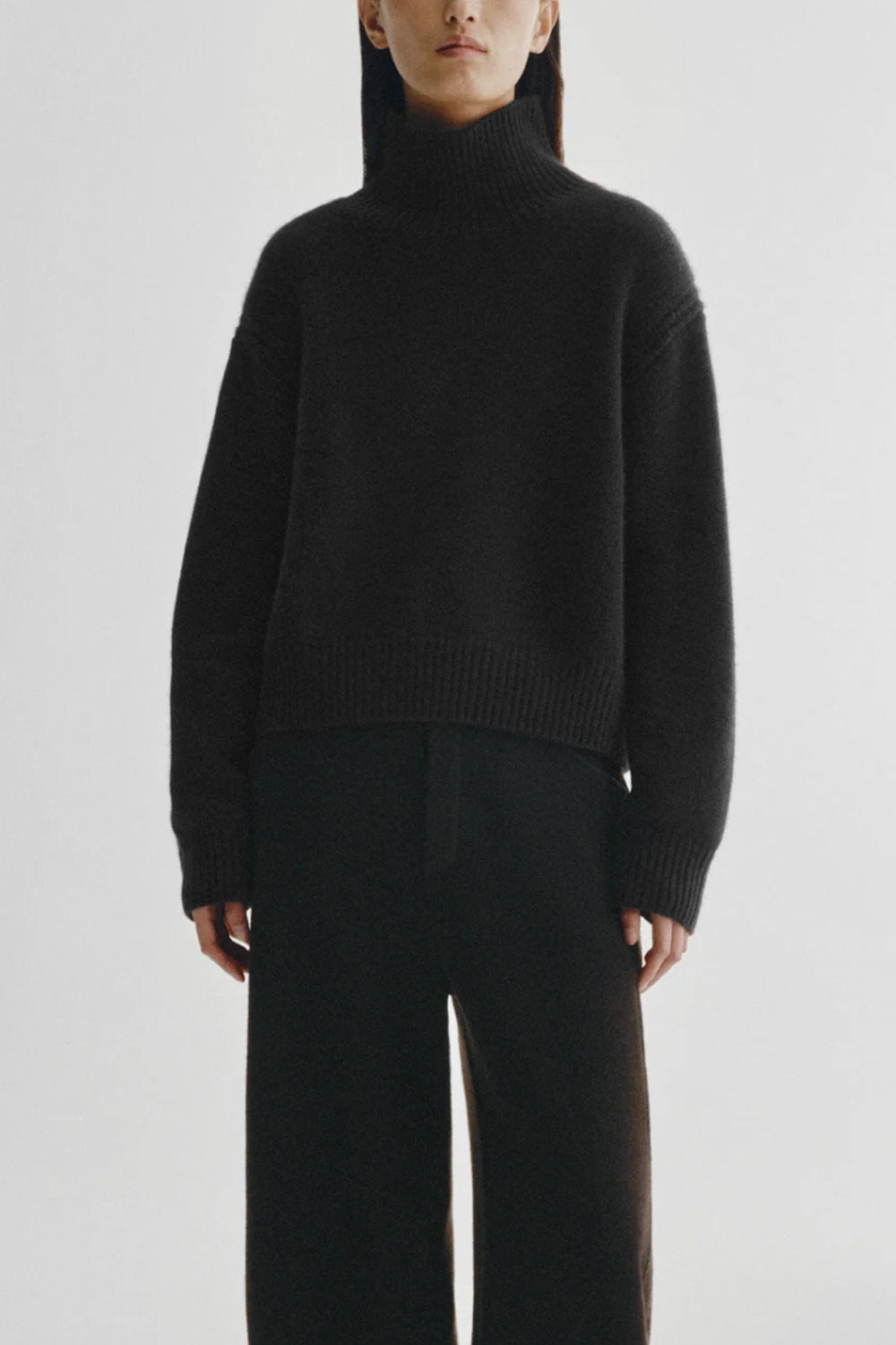 Black turtleneck sweater with back cutout