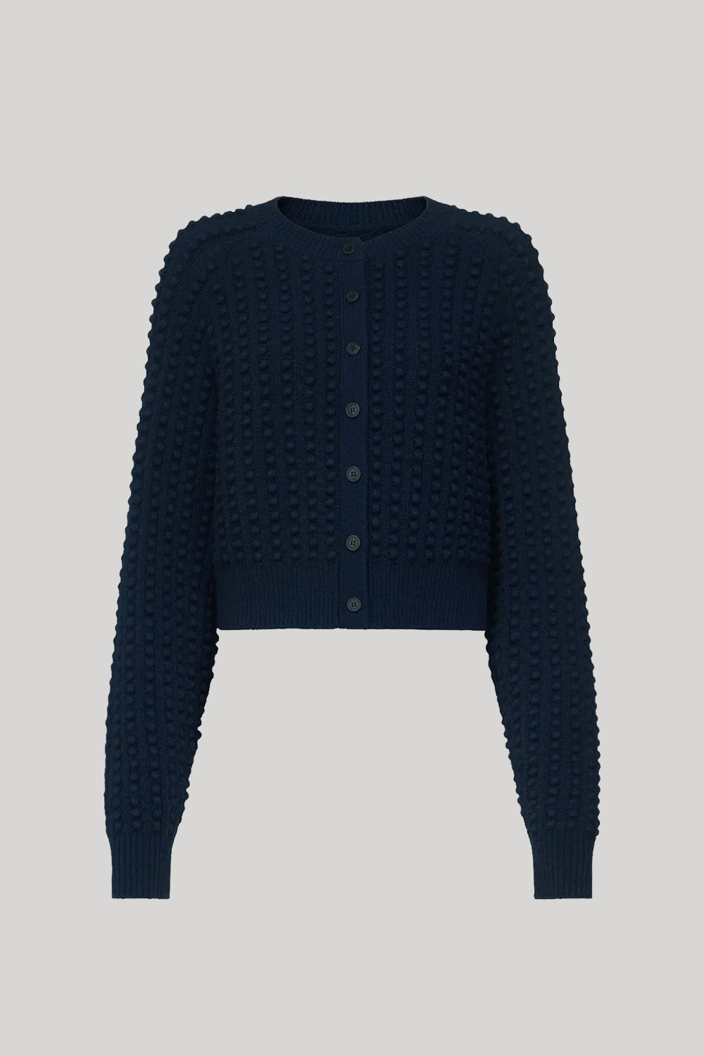 A dark navy blue cropped cardigan