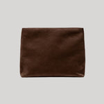 A dark brown suede envelope clutch from Nili Lotan pouch centered on a light gray background.