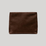 A dark brown suede envelope clutch from Nili Lotan pouch centered on a light gray background.