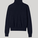 A dark navy blue knit turtleneck sweater