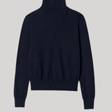 A dark navy blue knit turtleneck sweater