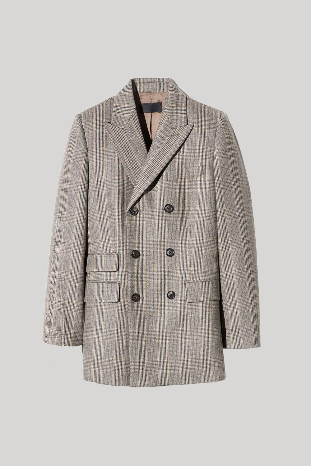 A double-breasted blazer in a gray and beige plaid pattern