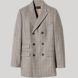 A double-breasted blazer in a gray and beige plaid pattern