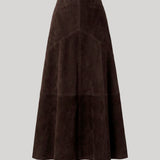 A dark brown maxi skirt in suede leather photgraphed on a grey background. The skirt is from Nour Hammour