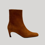 A single brown suede ankle boot with a low kitten heel, from Proenza Schouler, shown in profile against a solid light gray background.