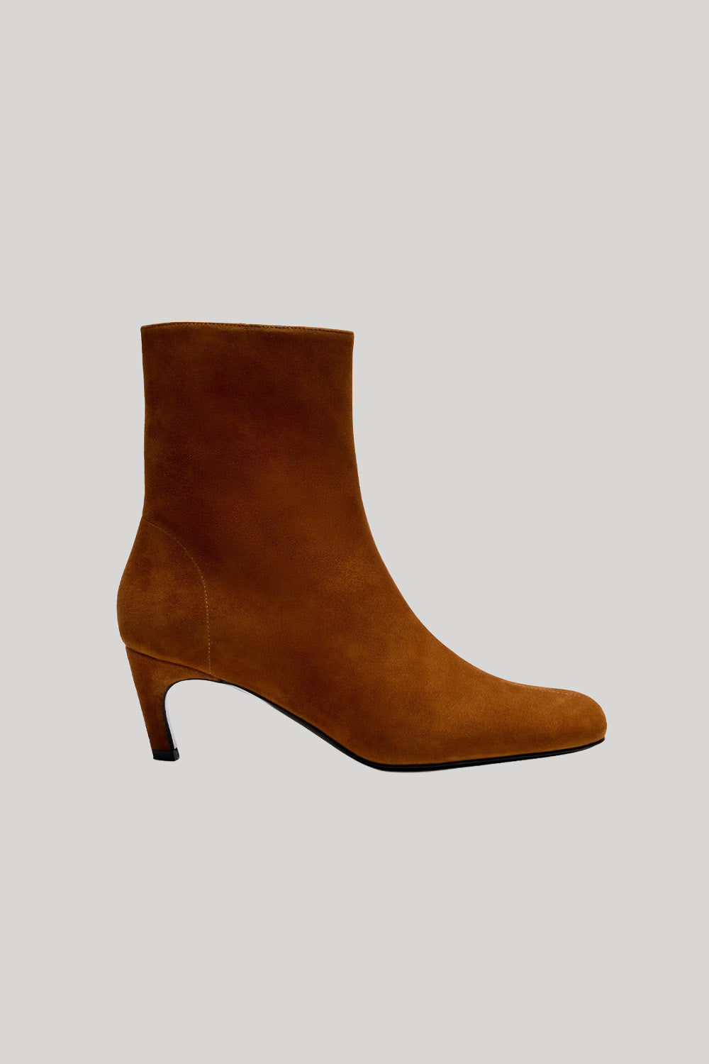A single brown suede ankle boot with a low kitten heel, from Proenza Schouler, shown in profile against a solid light gray background.