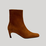 A single brown suede ankle boot with a low kitten heel, from Proenza Schouler, shown in profile against a solid light gray background.