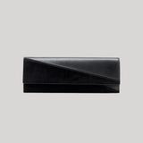 A black envelope clutch bag .