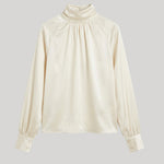 An off-white satin blouse 