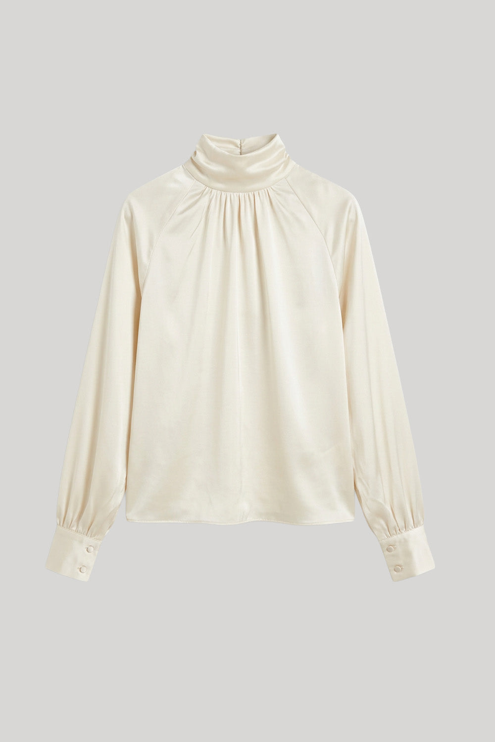 An off-white satin blouse 