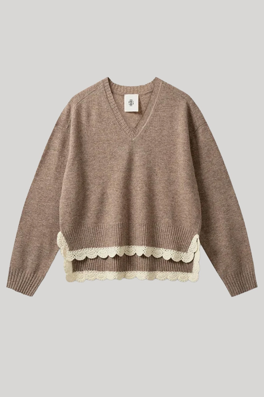 Beige sweater with white lace trim