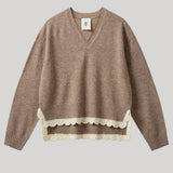 Beige sweater with white lace trim
