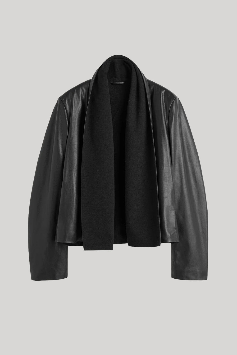 A black leather jacket with a draped, open-front design, displayed on a neutral light gray background.