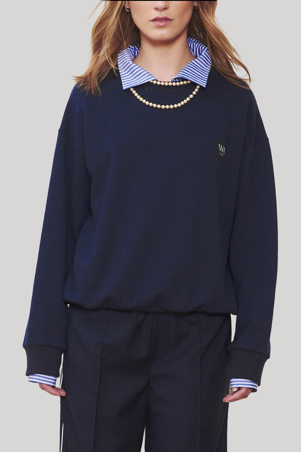 Navy blue sweater with striped collar detail